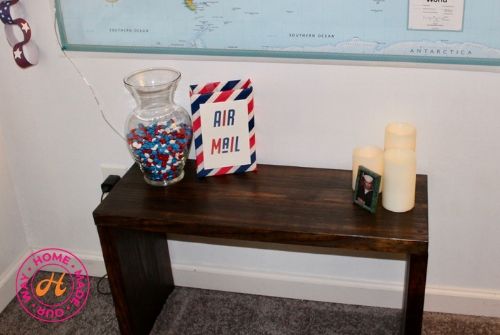 bench with jar of candy, box, photo, and candles