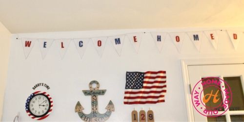 image of top portion of deployment wall with welcome home banner