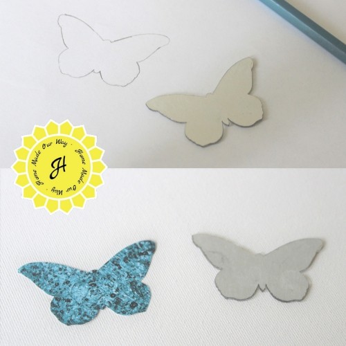 tracing and cutting out butterfly mirrors