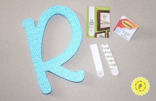 wooden letter R decorated in washi tape and 3m command picture hanging velcro strips