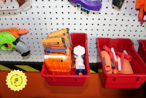 pegboard bins filled with nerf ammo and cartridges