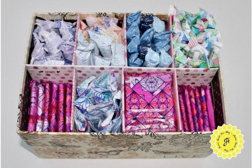 box with feminine care products sectioned and organized