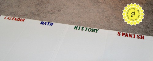 four section stenciled in on trifold board for homework station