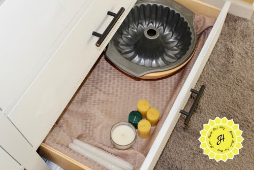 drawer with bowls and candles