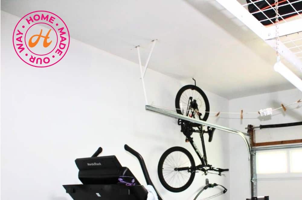 garage with bicycle hanging on hook